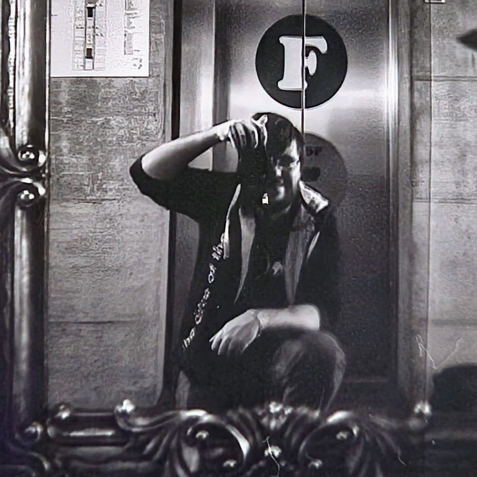 Hi, I’m Martin! Here I’m taking a selfie with a Nikon F70 in front of a mirror